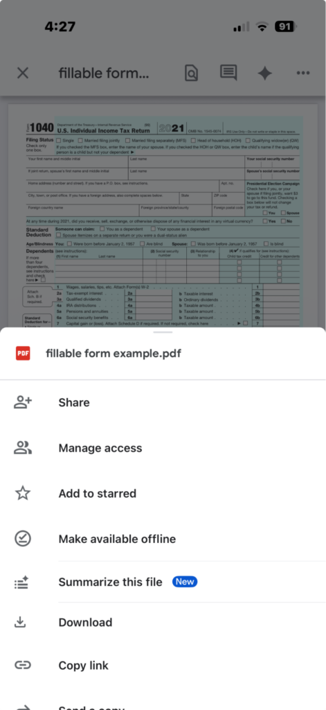 A screenshot from an iPhone showing an IRS 1040 and options to share, manage access, add to starred and more.