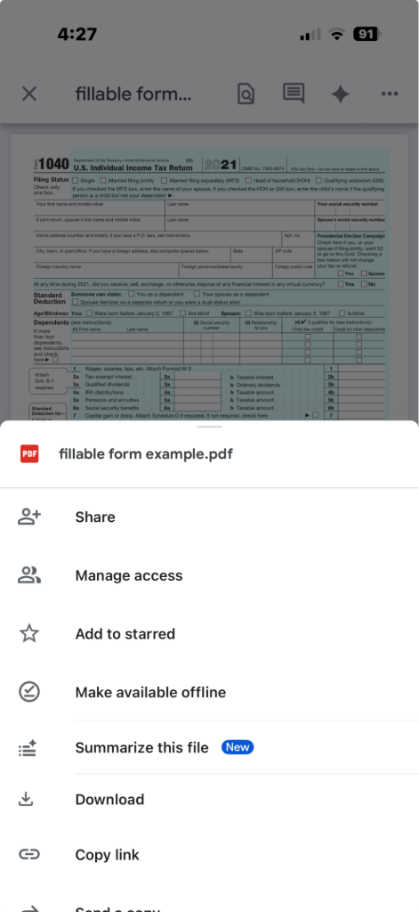 A screenshot from an iPhone showing an IRS 1040 and options to share, manage access, add to starred and more.